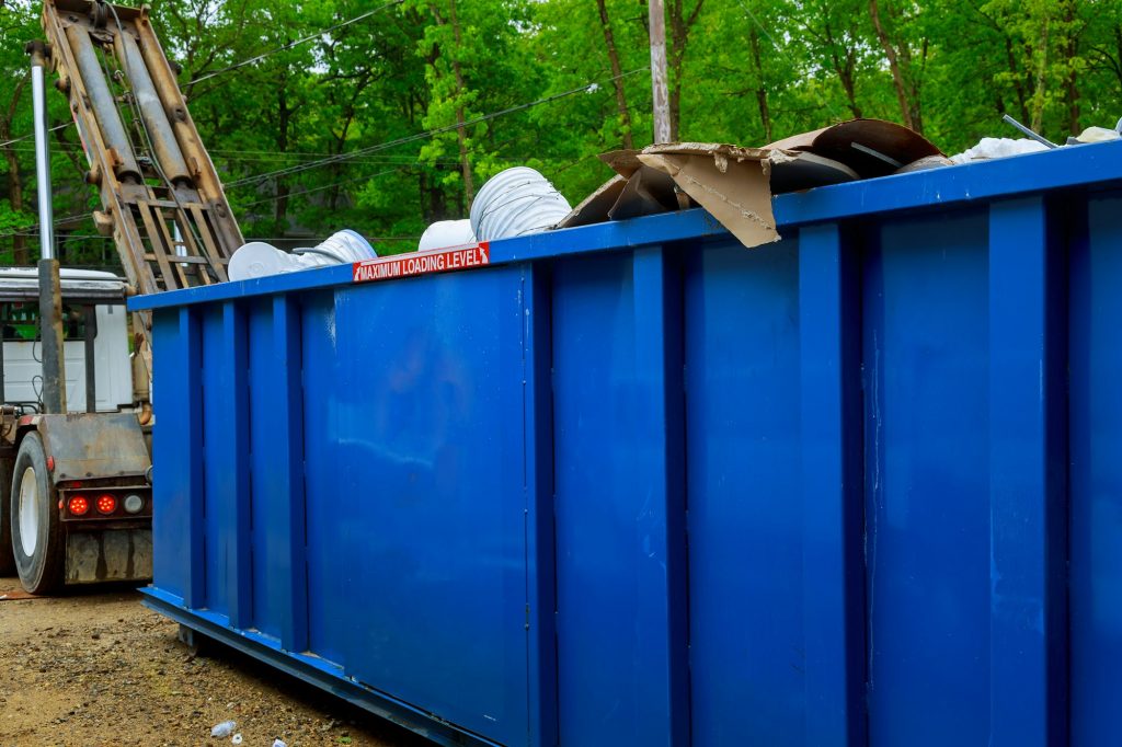 Blu dumpster, recycle waste recycling container trash on ecology and environment Selective focus